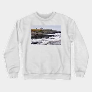 Waves battering the coast near Dustanburgh castle Northumberland, UK Crewneck Sweatshirt